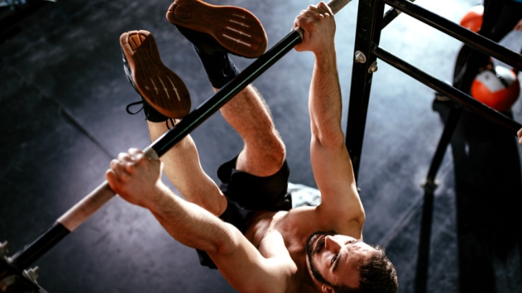 A person doing a toe-to-bar exercise
