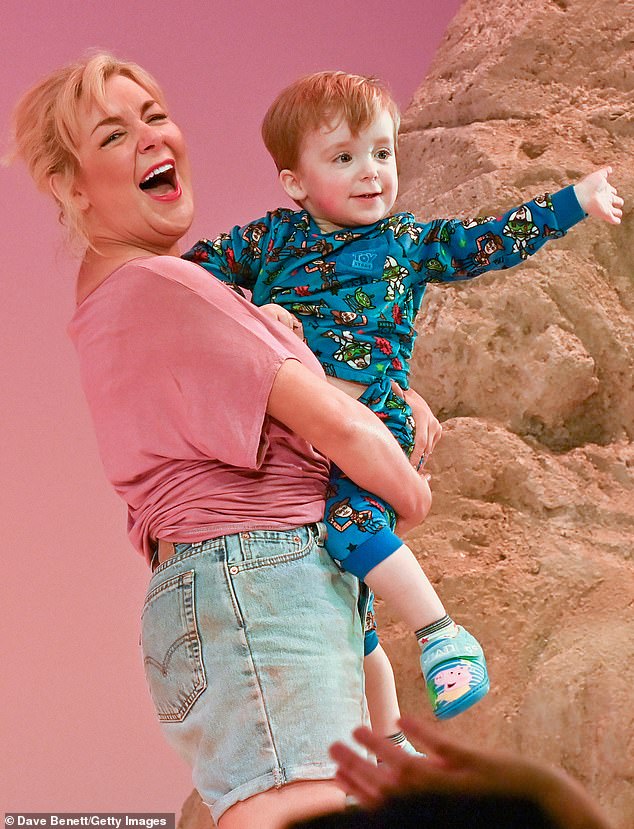In good company: An emotional Smith closed the performance by welcoming her 22-month old son Billy onto the stage
