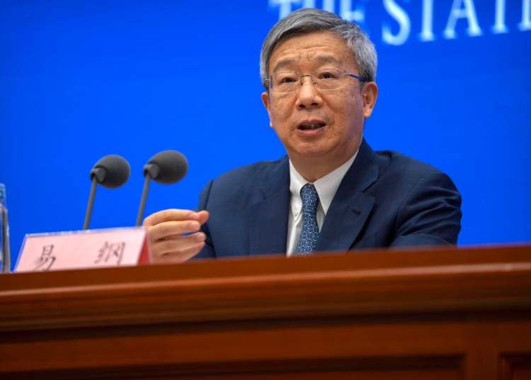 Favoring continuity, China reappoints central bank governor