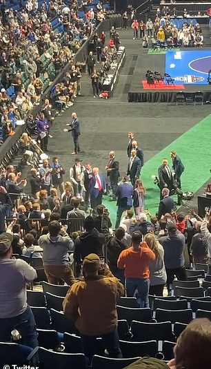 Donald Trump has received a standing ovation from Tulsa supporters as he arrived inside the NCAA Wrestling Championships at BOK Center