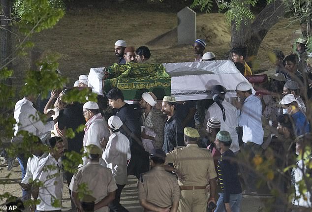 Relatives and locals carry the body of Ashraf Ahmad, who was also shot dead in the dramatic attack captured by live television on Saturday evening before police could arrest the attackers