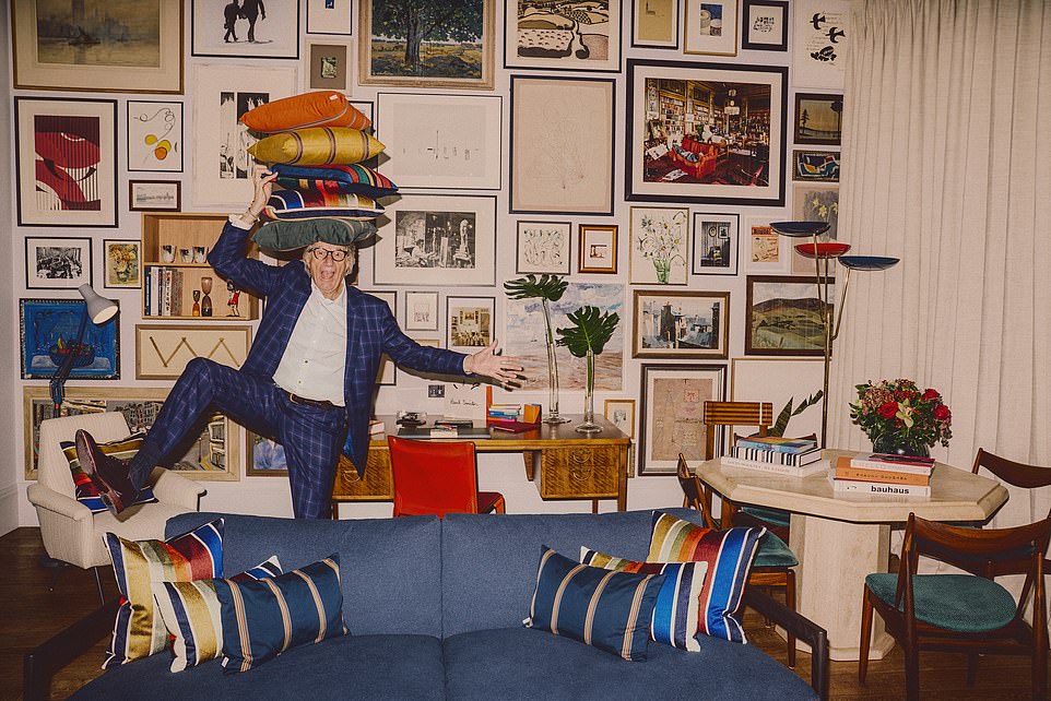 Sir Paul having fun in his new suite. The wall behind the designer is tightly packed with framed paintings and limited-edition prints from his photographer friend Julian Broad, who shot his wedding pictures