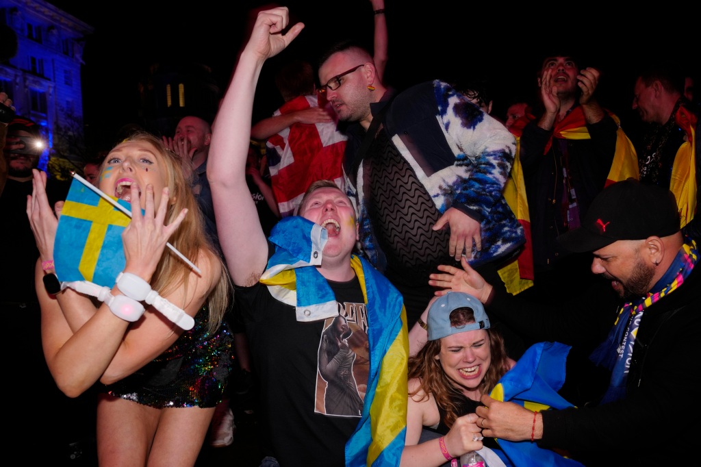 Swedish Eurovision fans in the Fan Zone react as Loreen of Sweden wins Grand Final of the Eurovision Song Contest in Liverpool, England, Saturday, May 13, 2023.