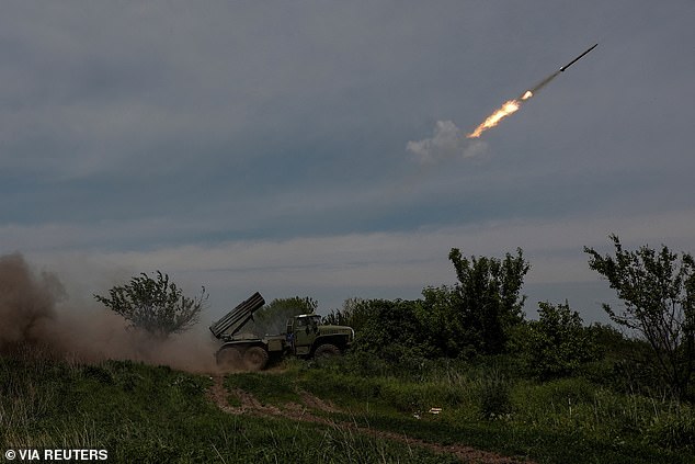 Ukrainian servicemen fire a BM-21 Grad multiple launch rocket system towards Russian troops attacking Bakhmut