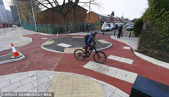 A pedestrian said: ‘I can’t see cyclists going all the way around it. They’ll just take a shortcut'