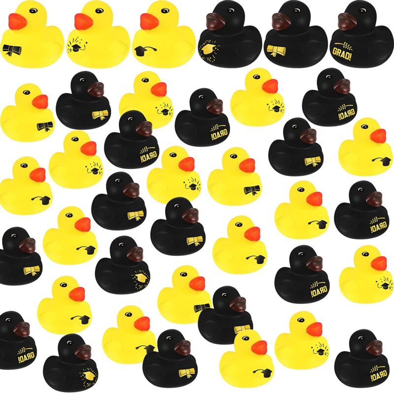 A bunch of black and yellow rubber ducks say grad on them.