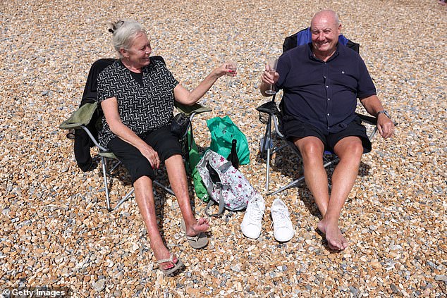 BRIGHTON: Tom and Pam, from London, enjoy the hot weather at Brighton beach