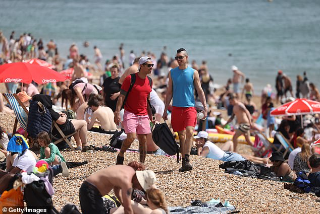 BRIGHTON: Barely a metre of sand could be seen as crowds piled onto the beach in Brighton