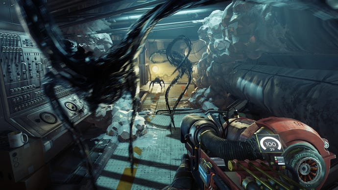 Several black gooey aliens leap at the player in Prey