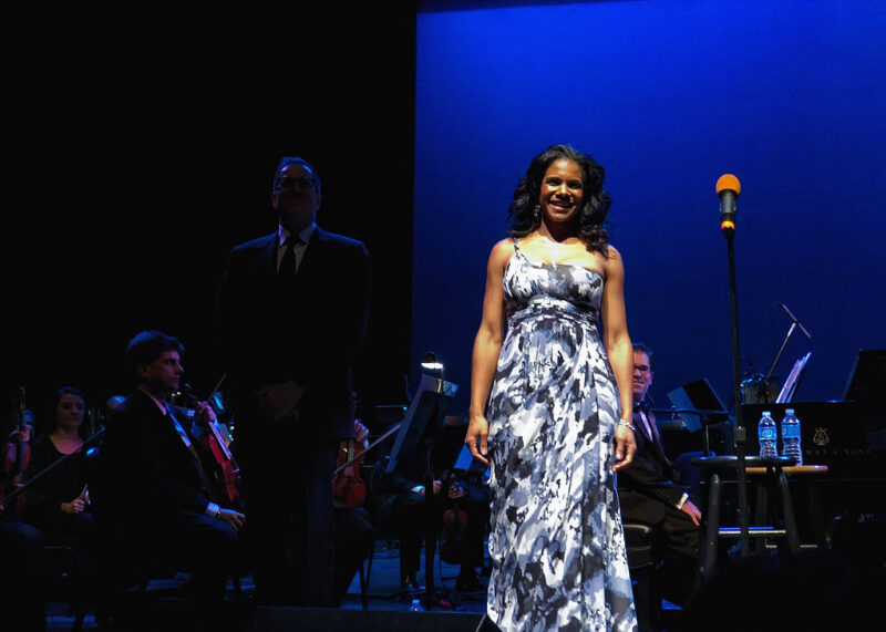 Audra McDonald on stage in gown