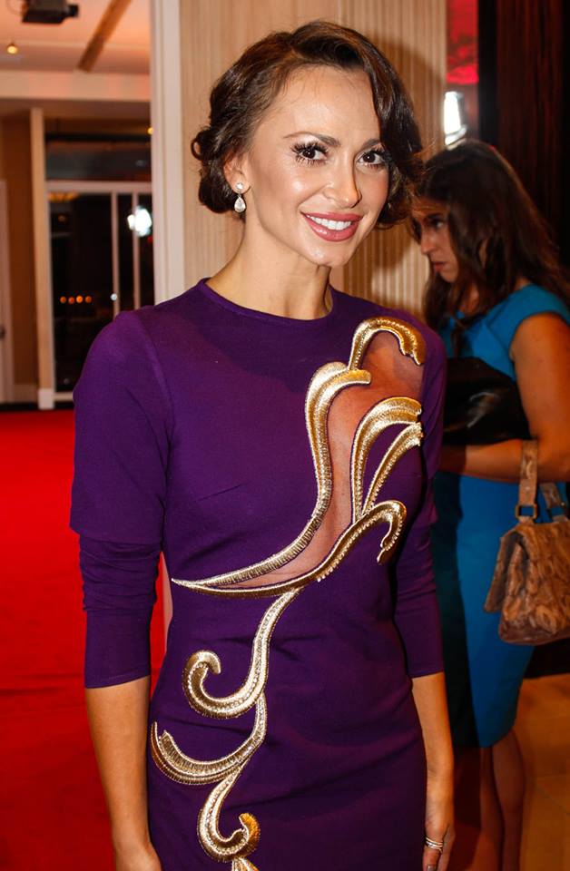 Karina Smirnoff on the red carpet wearing a purple dress