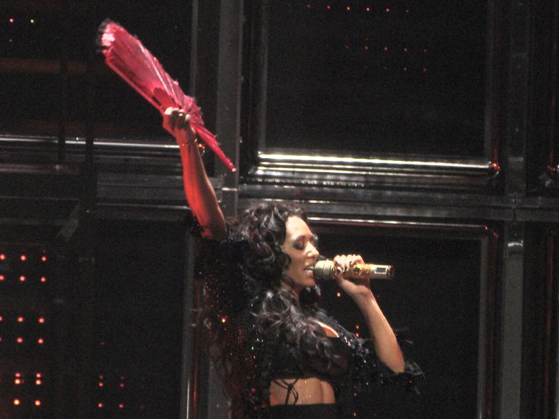 Mel B, otherwise known as Scary Spice, on stage with a red fan