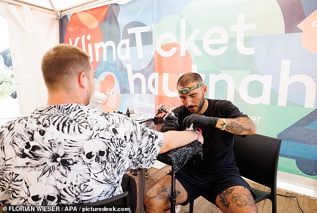 Pop-up tattoo parlours (above) were set up at the recent Frequency Festival and Electric Love Festival, in Austria, and the first three people to come forward at each event received the pass
