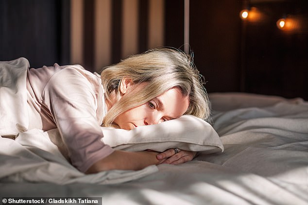 Simply sitting by a window won't do when it comes to becoming 'more lark' and sleep earlier - nor will switching on the lights (stock photo)