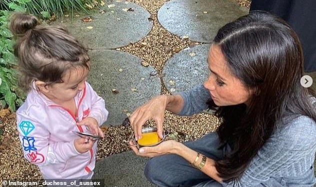 During her visit to the cafe, the Duchess shared a sweet moment with a little girl who appeared to present her with a dish