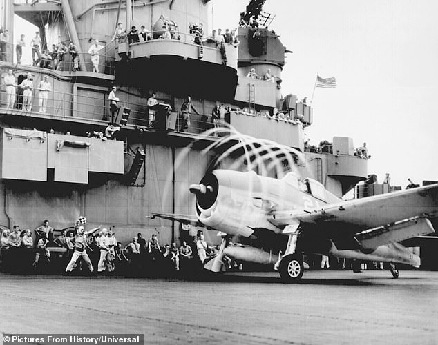 A US Navy Grumman F6F Hellcat fighter preparing to launch off USS Yorktown to attack a target in the Japanese-controlled Marshall Islands
