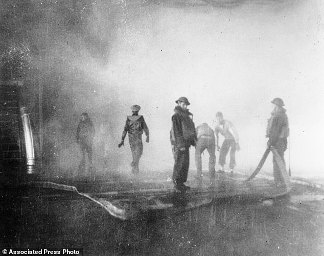 Crewmen aboard the USS Yorktown battle fire after the carrier was hit by Japanese bombs. Later the vessel had to be abandoned and was sunk by a Japanese submarine torpedo hit
