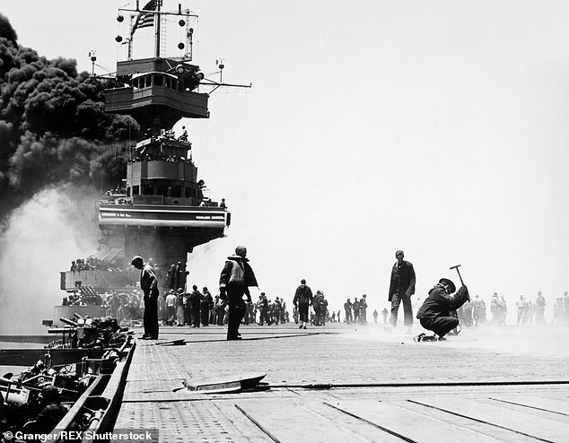 Art imitating life: Smoke billows from the bridge of the USS Yorktown, damaged by aerial attacks on the second day of the battle on 4 June 1942