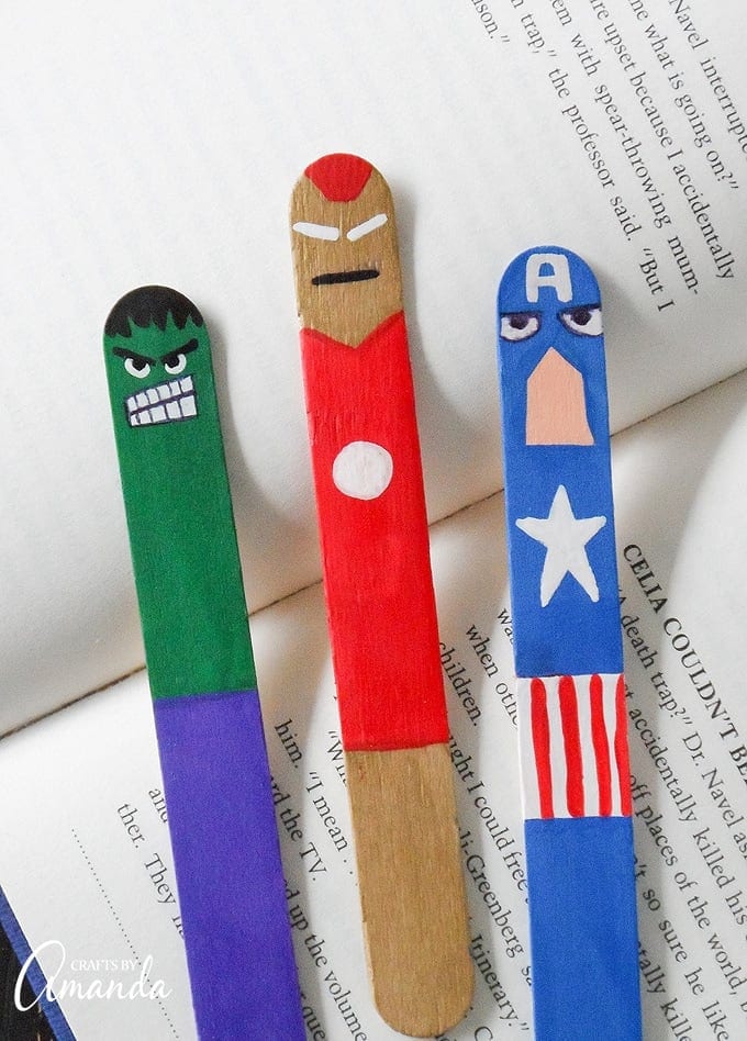 Three popsicle sticks are painted to look like the Hulk, Iron Man, and Captain America