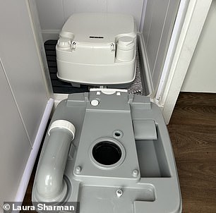 The indoor shower and kitchen sink are fed by a 55-litre water tank and there is a 21-litre chemical toilet, pictured above, stored in the shower room