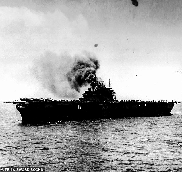 The battle of Midway took place between June 4 and June 7, 1942 - six months after the Japanese surprise attack on Pearl Harbor. Pictured:  USS Yorktown photographed after being hit by Japanese bombs just after midday on June 4. This view was taken shortly after the ship lost power. Note the F4F-4 fighters are still spotted forward, their location during the attack