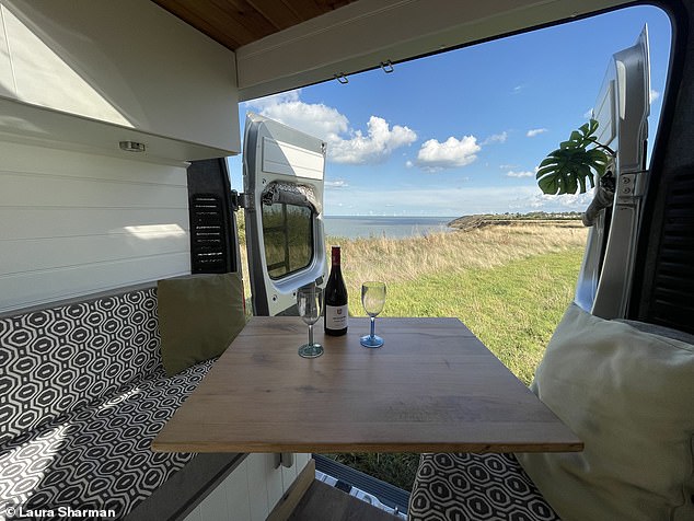 Franky is 'a two-berth camper with a chic interior that evokes a feeling of home the moment you step inside'. The van is pictured above during Laura's trip at Clifftop Camping on the Isle of Sheppey in Kent