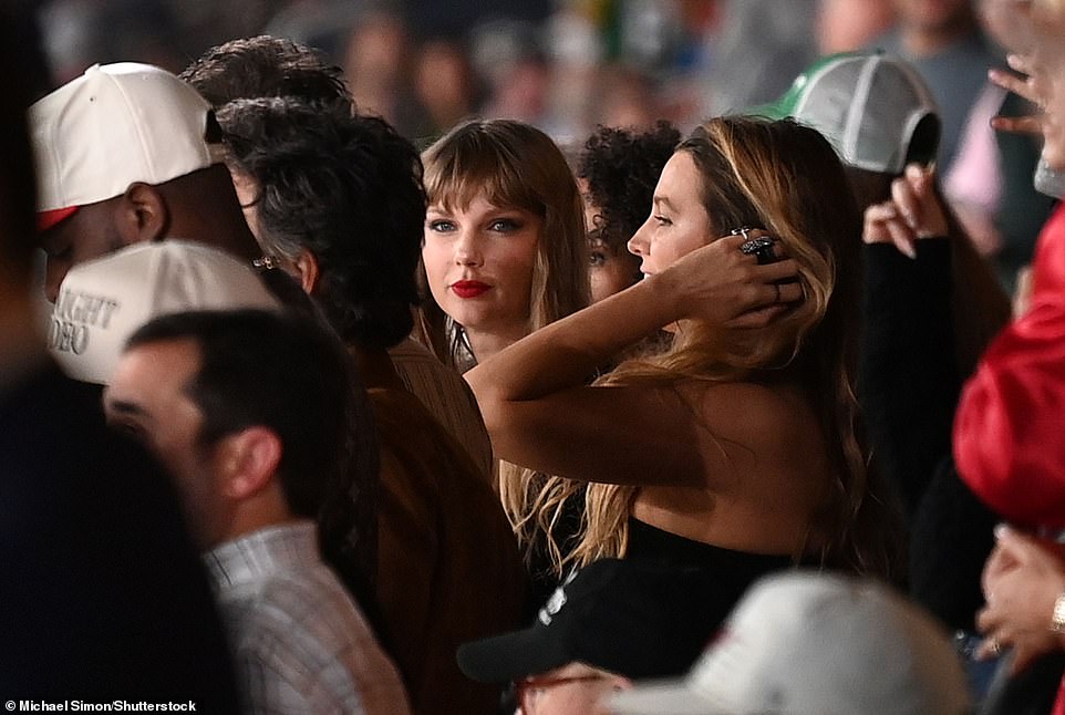 Listening: Taylor was also spotted intently listening to someone from her entourage on the game day