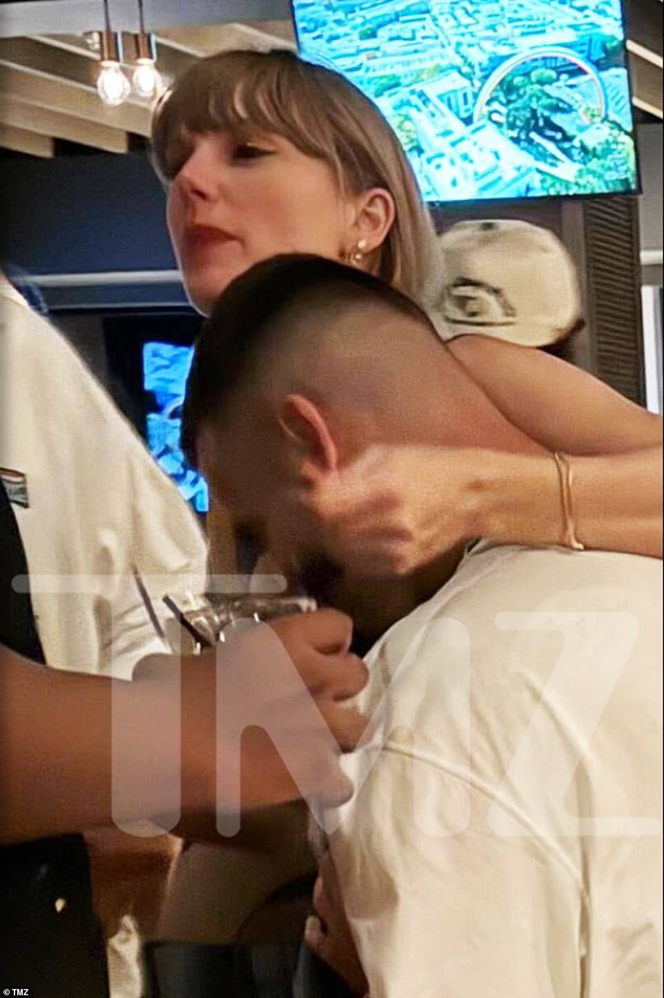 Cozying up: The pair were seen last Sunday sharing a bit of affection as they spent time at the Kansas City restaurant in photos obtained by TMZ