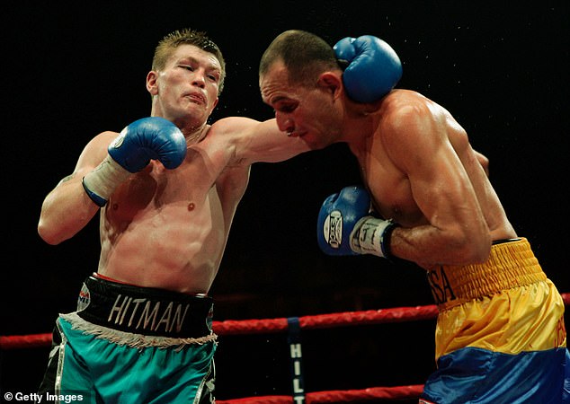 Doing what he does best: Ricky (L) in action against Carlos Maussa (R) during their unification light welterweight title fight at the Sheffield Arena November 26, 2005 in Sheffield