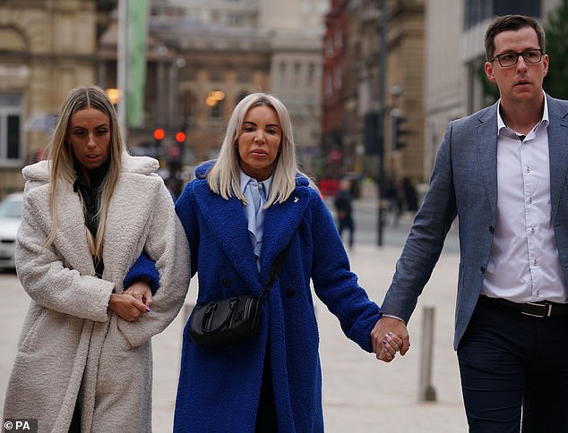 Julie Dale (centre) is accompanied into court by members of her family