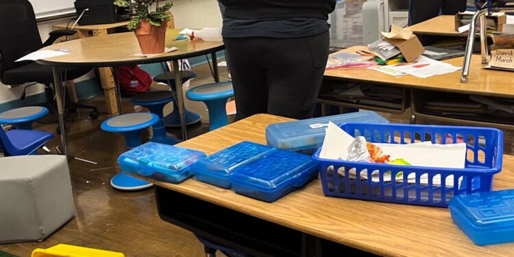 School officials inspect damage from a break-in and vandalism at Wadsworth Elementary School.