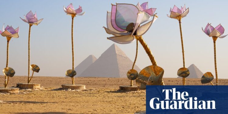 Giant flowers, a buried chariot and temples in the sand: the art show in the shadow of Giza pyramids