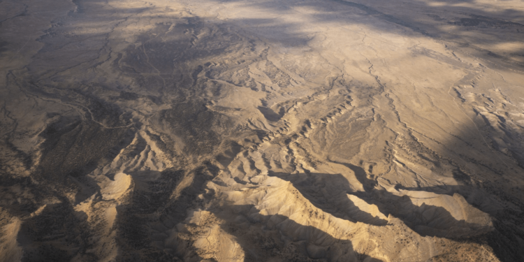 An aerial image of a brown and yellow desert