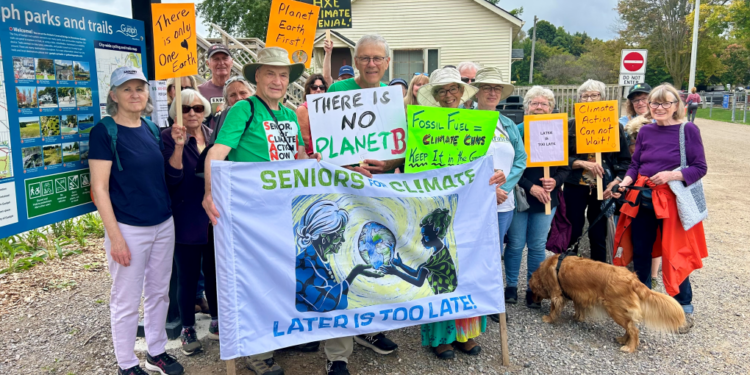 Seniors holding signs about the need for climate action