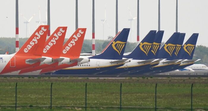 EasyJet and Ryanair planes stand on the tarmac at Willy Brandt Berlin Brandenburg international airport in Germany