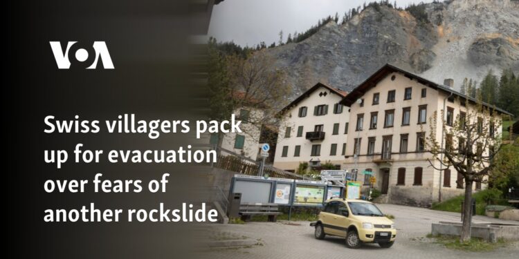 Swiss villagers pack up for evacuation over fears of another rockslide