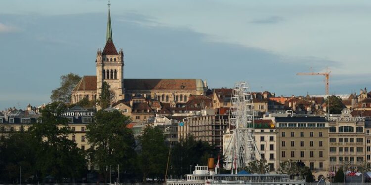 © Reuters. FILE PHOTO: The St. Pierre Cathedral is seen early morning near Lake Leman in Geneva, Switzerland May 27, 2019. REUTERS/Denis Balibouse/File photo