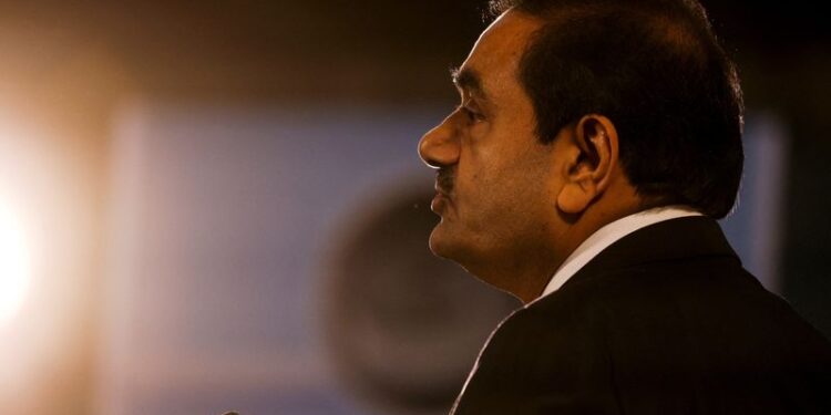 © Reuters. FILE PHOTO: Indian billionaire Gautam Adani speaks during an inauguration ceremony after the Adani Group completed the purchase of Haifa Port earlier in January 2023, in Haifa port, Israel January 31, 2023. REUTERS/Amir Cohen/File Photo