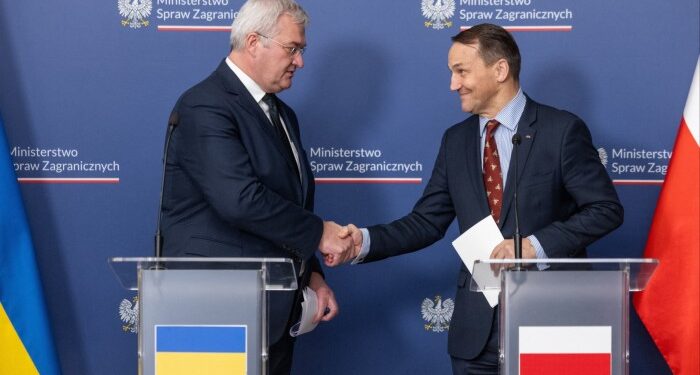 Poland’s foreign minister Radek Sikorski, right, meets his Ukrainian counterpart Andrii Sybiha