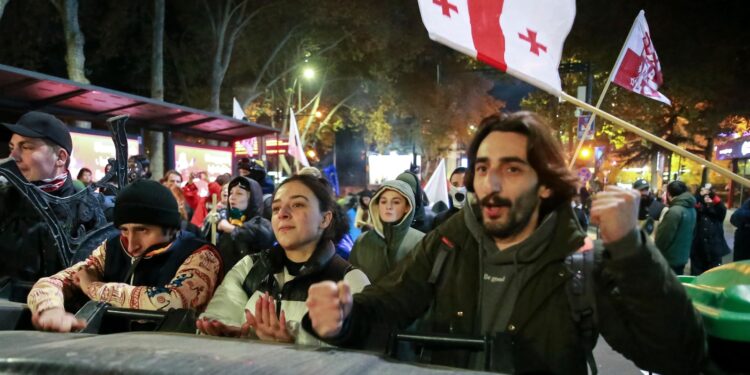 Police in Georgia's capital break up a tent camp set up by protesters demanding a new election