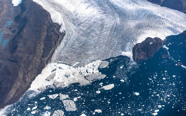 An aerial view of icebergs and ice sheet in the Baffin Bay