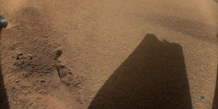 A shadow of a broken helicopter rotor on Mars