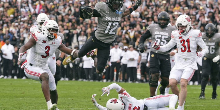 Colorado wide receiver Travis Hunter flies in for a touchdown against Utah on Nov. 16, 2024, in Boulder, Colo.