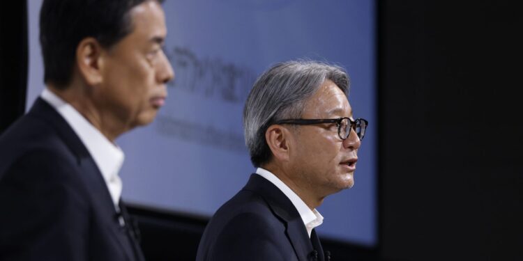 Toshihiro Mibe, chief executive officer of Honda Motor Co., right, speaks next to Makoto Uchida, chief executive officer of Nissan Motor Co., during a joint news conference in Tokyo, Japan, on Thursday, Aug. 1, 2024.