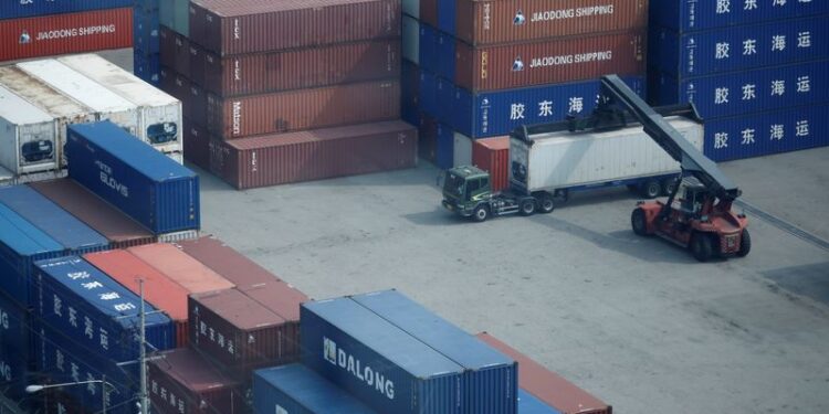 © Reuters. FILE PHOTO: A truck moves a shipping container at Pyeongtaek port in Pyeongtaek, South Korea, July 9, 2020. REUTERS/Kim Hong-Ji/File Photo