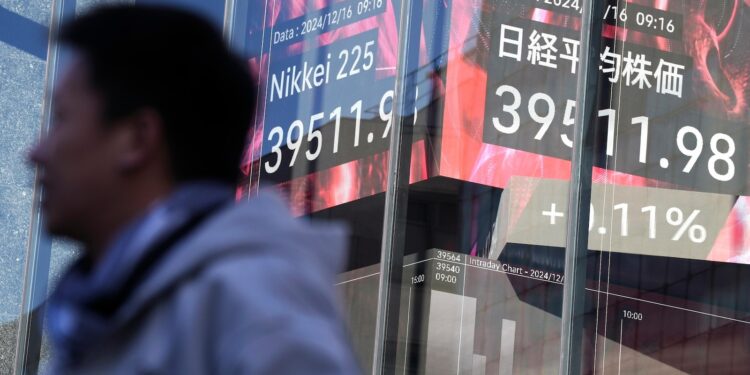 Stock market today: Asian shares are mixed after Nasdaq sets a record ahead of Fed meeting