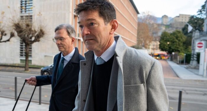 Michael Wainwright, former Trafigura chief operating officer, right, and his lawyer Daniel Kinzer arriving at the Federal Criminal Court in Bellinzona, Switzerland, on Monday