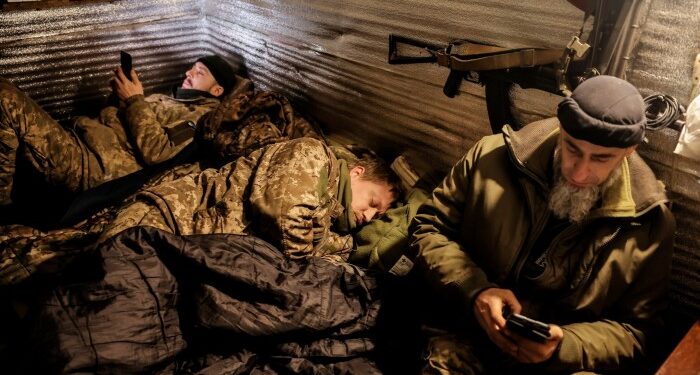 24th Mechanised Brigade troops rest  in a shelter on the front line in Donetsk